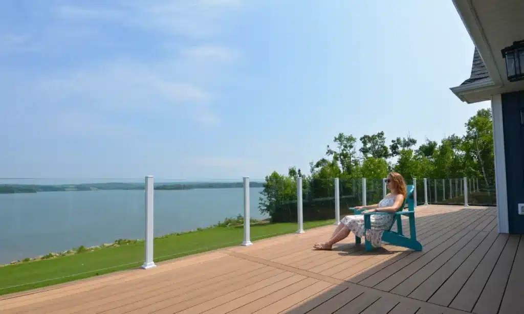 Topless glass railing around a spacious waterfront deck