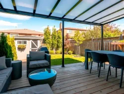 Furnished GTA backyard beneath a bright acrylic patio cover