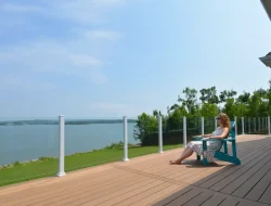 Topless glass railing around a spacious waterfront deck